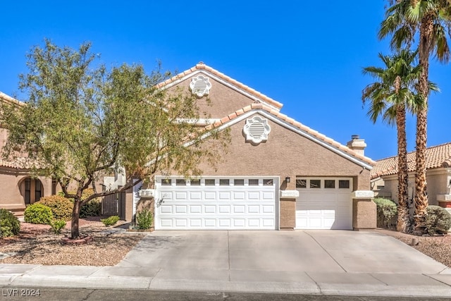 front facade with a garage