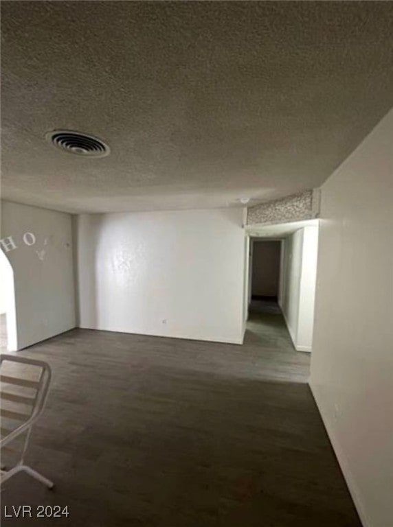 interior space featuring a textured ceiling