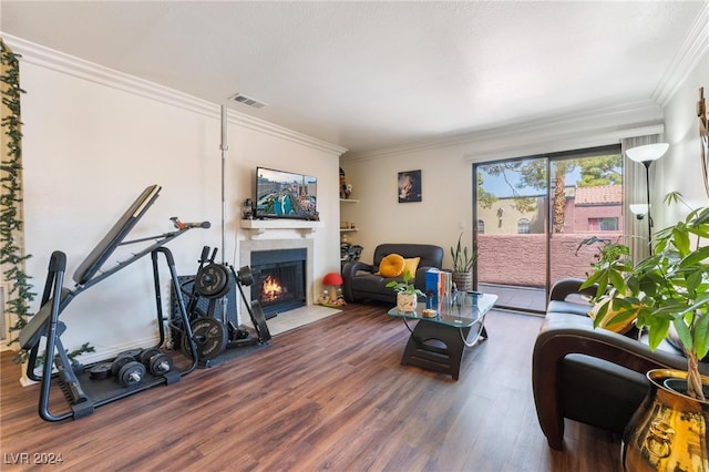 living room with ornamental molding and hardwood / wood-style flooring