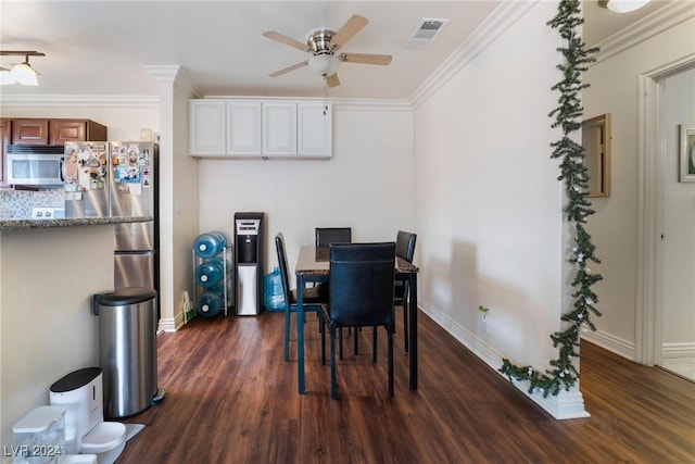 dining space featuring crown molding, dark hardwood / wood-style flooring, and ceiling fan