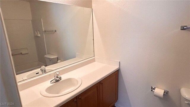 bathroom with toilet and vanity