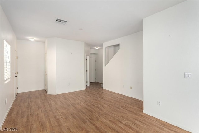 9333 Leaping Deer Pl Unit 102, Las Vegas, NV 89178 - empty room featuring wood finished floors and baseboards