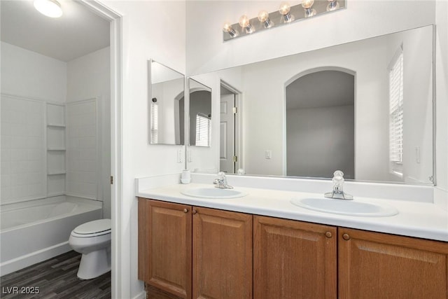 9333 Leaping Deer Pl Unit 102, Las Vegas, NV 89178 - bathroom with double vanity, toilet, and wood finished floors
