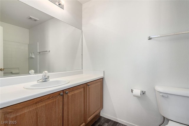 9333 Leaping Deer Pl Unit 102, Las Vegas, NV 89178 - bathroom with toilet, vanity, wood finished floors, and baseboards