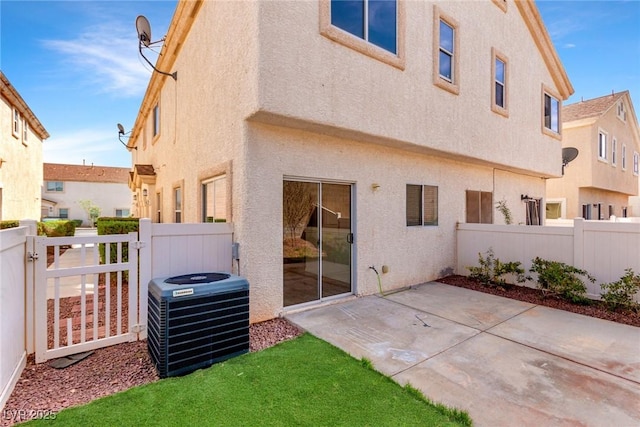 9333 Leaping Deer Pl Unit 102, Las Vegas, NV 89178 - back of house with central air condition unit, stucco siding, and a fenced backyard