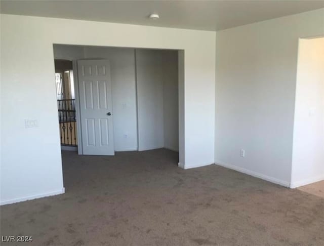 empty room featuring carpet flooring