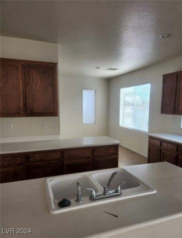 kitchen featuring a textured ceiling