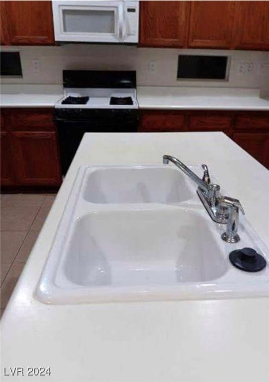 kitchen with sink and white appliances