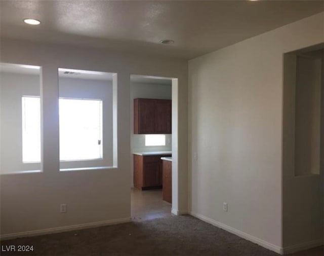 spare room featuring carpet floors