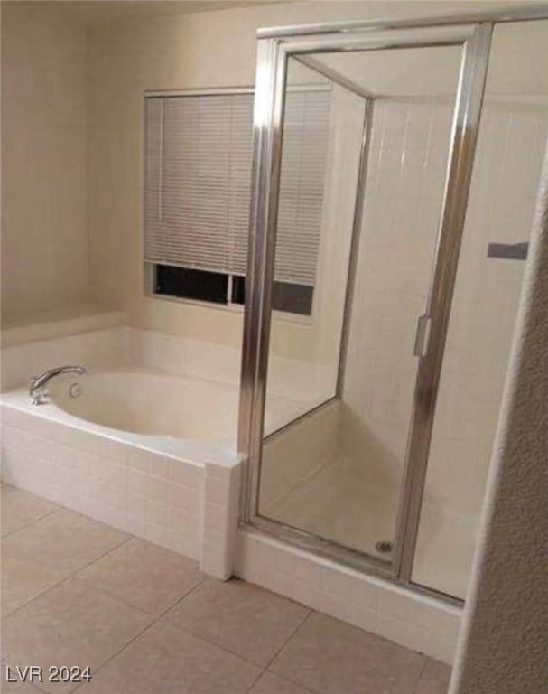 bathroom with plus walk in shower and tile patterned flooring