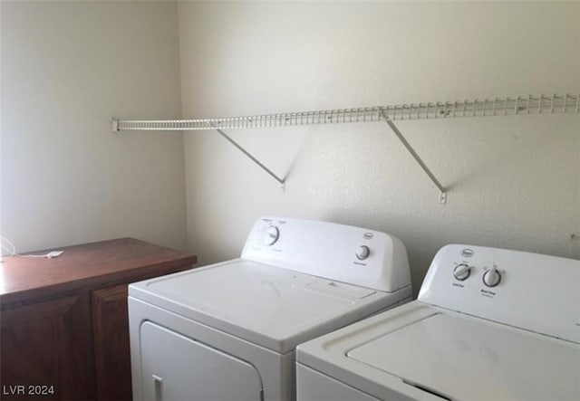 laundry area with cabinets and washer and dryer