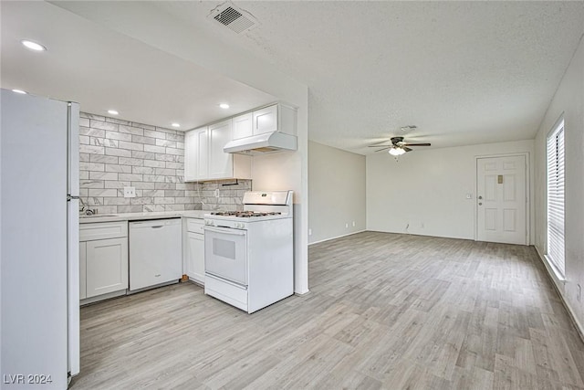 kitchen featuring sink, white cabinets, white appliances, and light hardwood / wood-style flooring