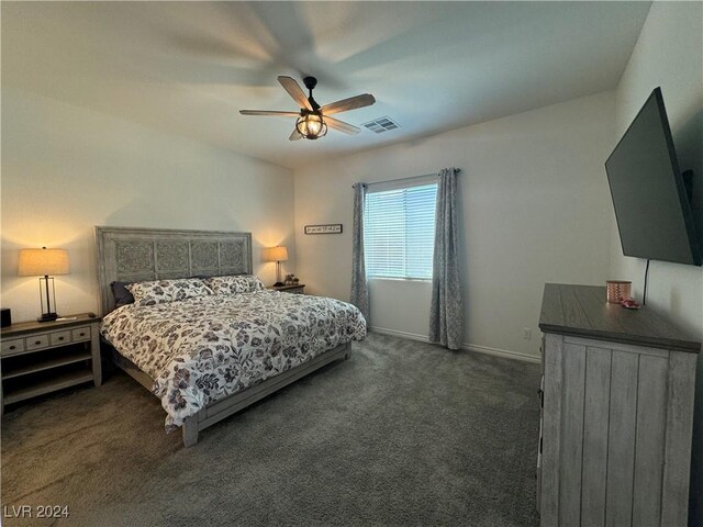 bedroom featuring dark colored carpet and ceiling fan