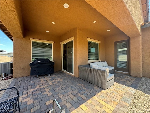 view of patio with a grill, central AC unit, and outdoor lounge area