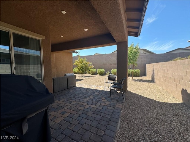 view of patio featuring area for grilling and a fenced backyard