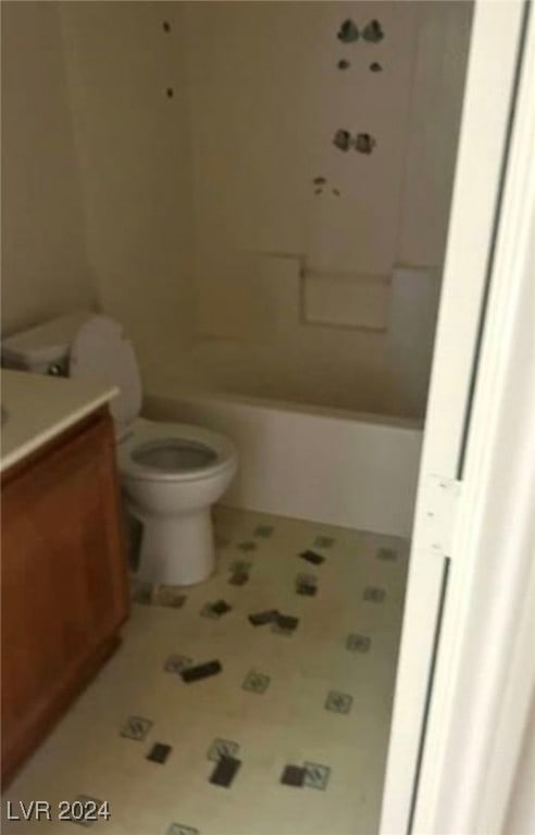 full bathroom with washtub / shower combination, toilet, tile patterned floors, and vanity