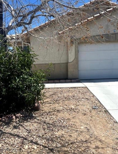 view of property exterior featuring a garage