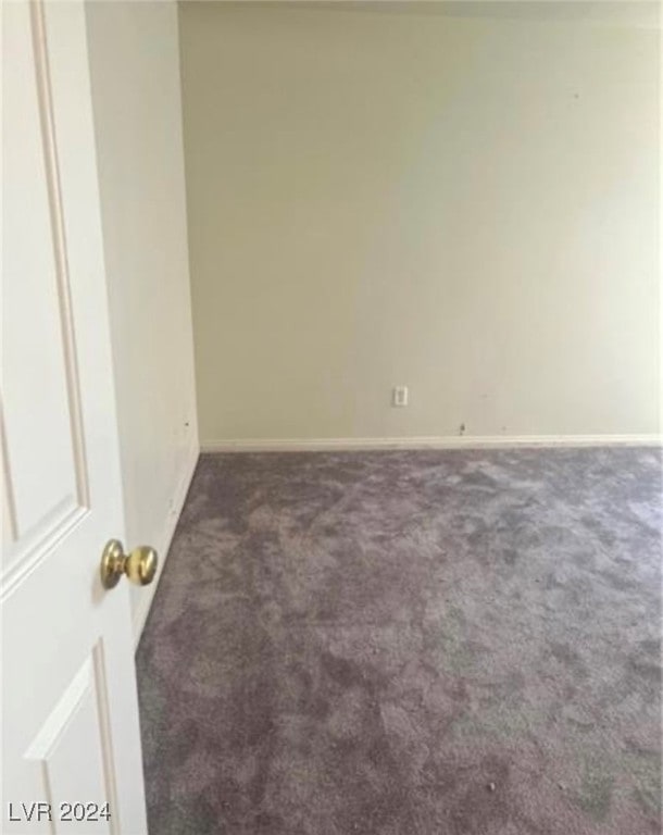 empty room with carpet flooring