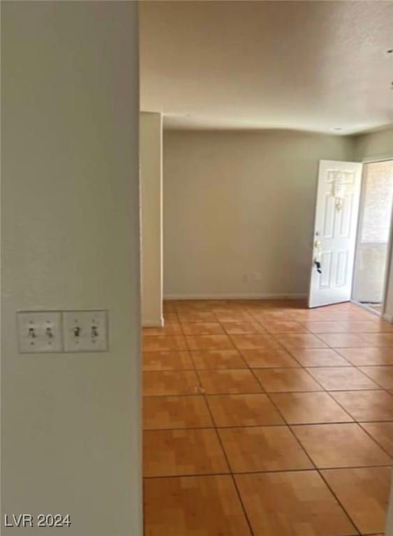 spare room with tile patterned floors