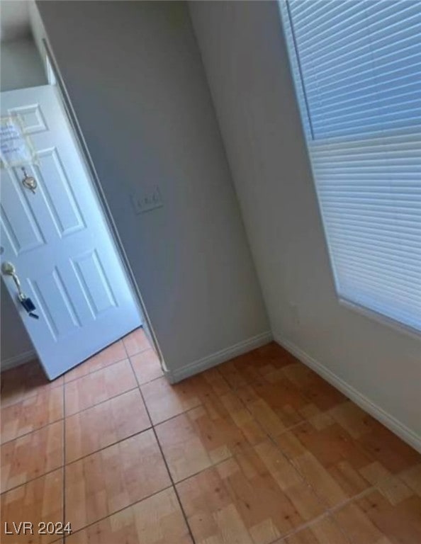 additional living space featuring light tile patterned floors