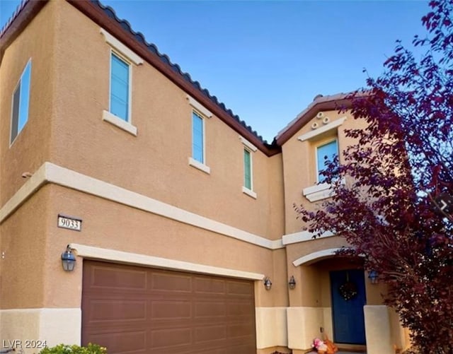 view of front of property featuring a garage