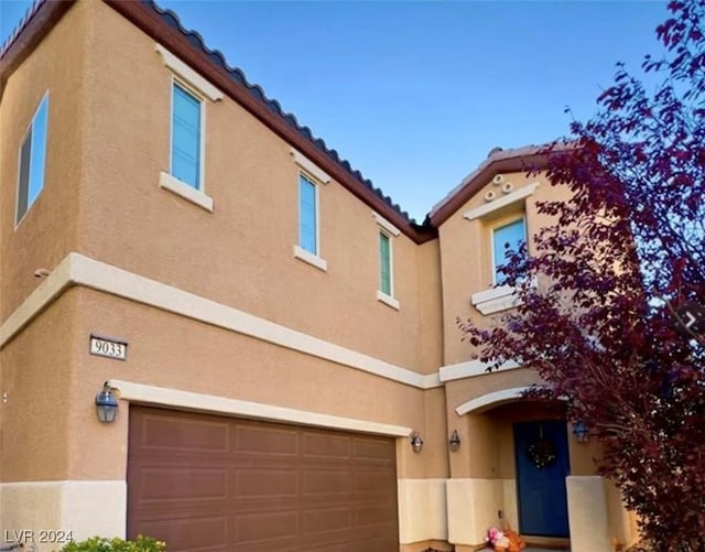 view of front of property with a garage