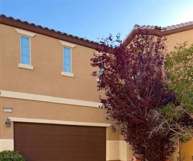 view of property exterior with a garage