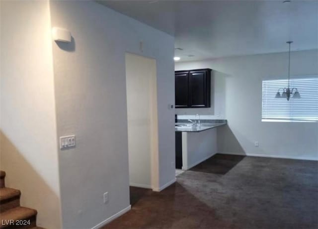 kitchen with dark colored carpet