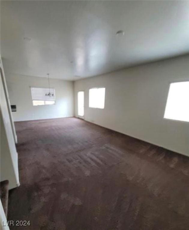 interior space featuring dark colored carpet