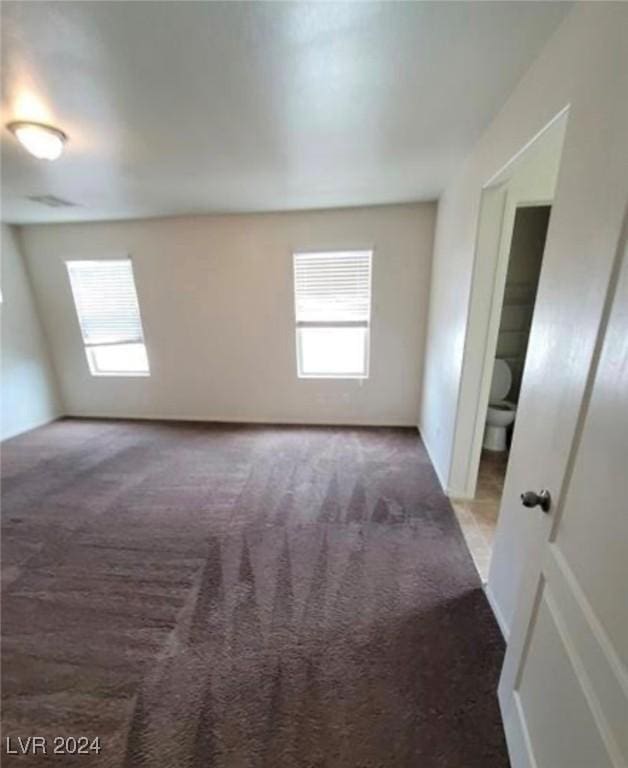 spare room featuring carpet