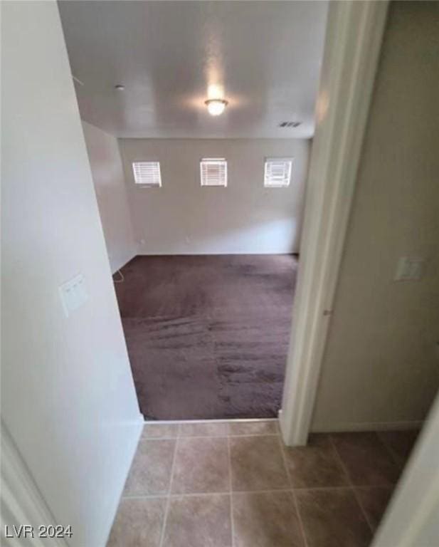 corridor with tile patterned floors