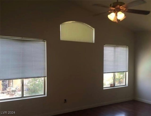 empty room featuring ceiling fan, hardwood / wood-style flooring, and plenty of natural light