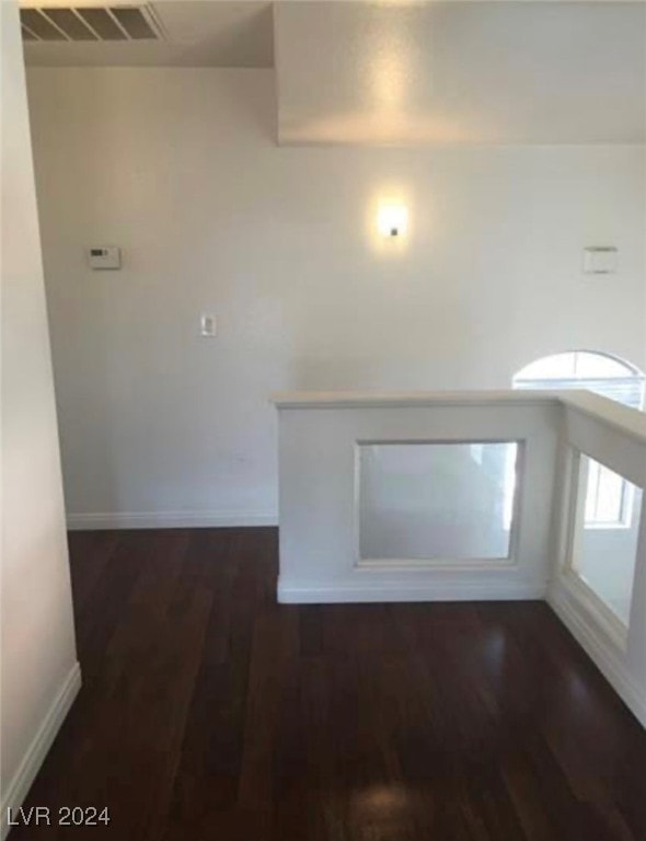 hallway featuring hardwood / wood-style flooring