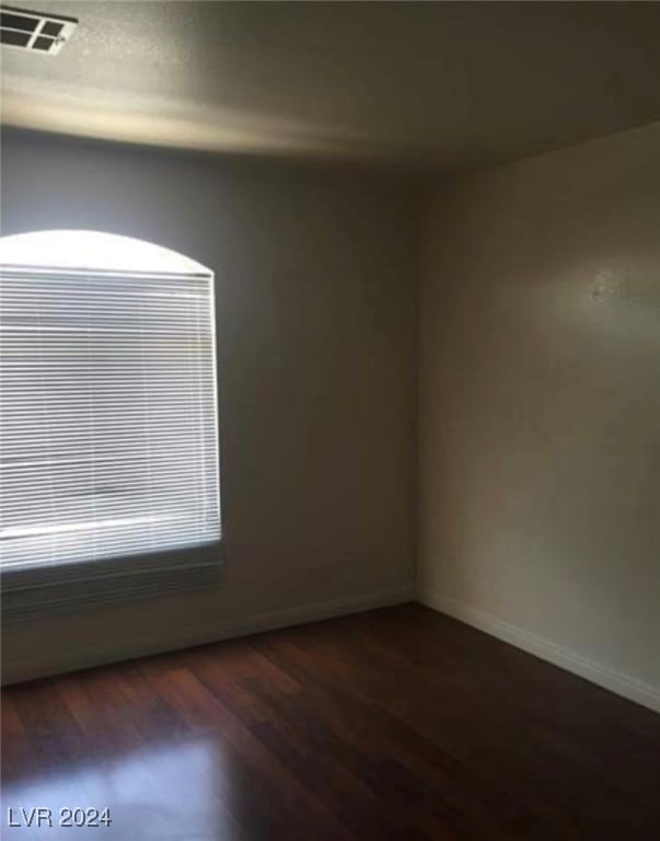 empty room with hardwood / wood-style floors