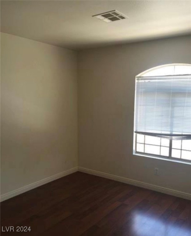 unfurnished room featuring hardwood / wood-style flooring