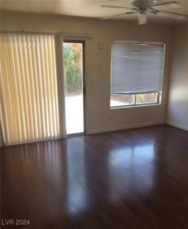 spare room featuring ceiling fan and hardwood / wood-style flooring