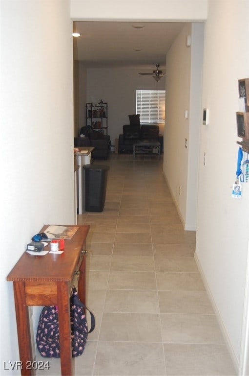 corridor with light tile patterned floors