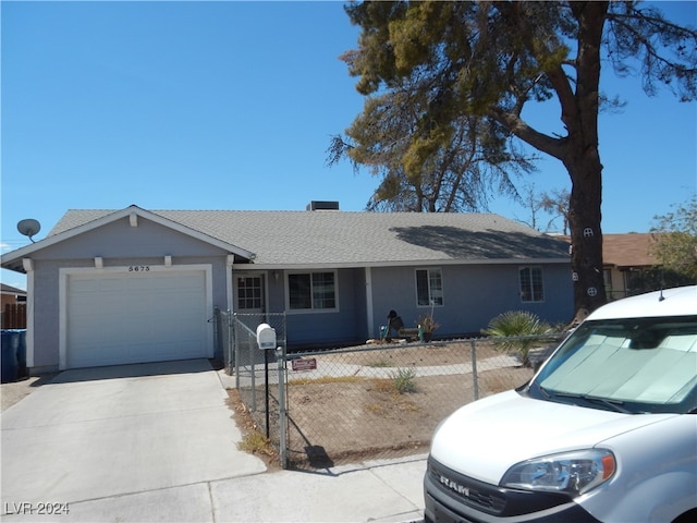 single story home with a garage