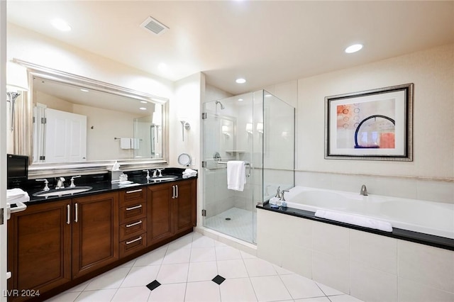 full bathroom with a bath, a shower stall, double vanity, tile patterned flooring, and recessed lighting