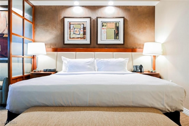 bedroom featuring baseboards