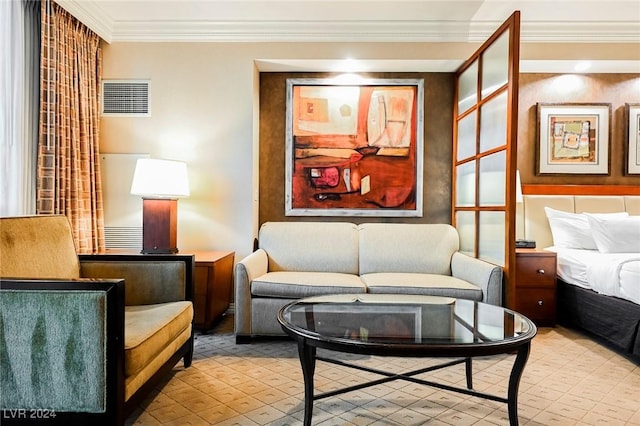 sitting room featuring ornamental molding and light flooring