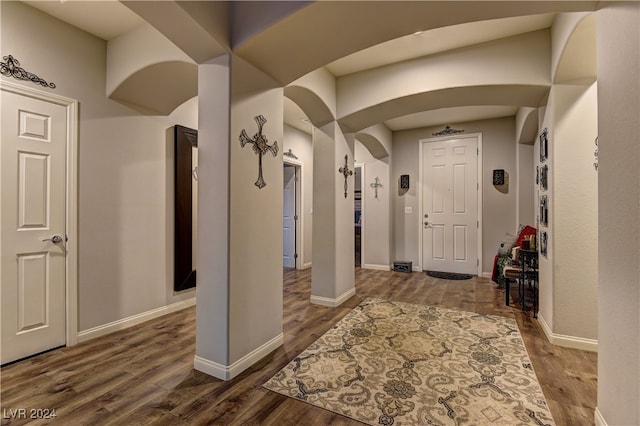 entryway with hardwood / wood-style floors