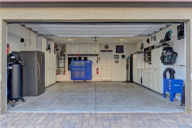 garage with ceiling fan, gas water heater, stainless steel fridge, and stainless steel refrigerator