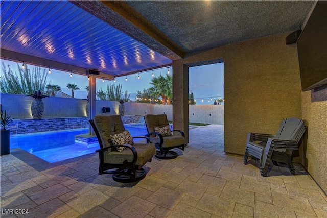 view of patio with a fenced in pool