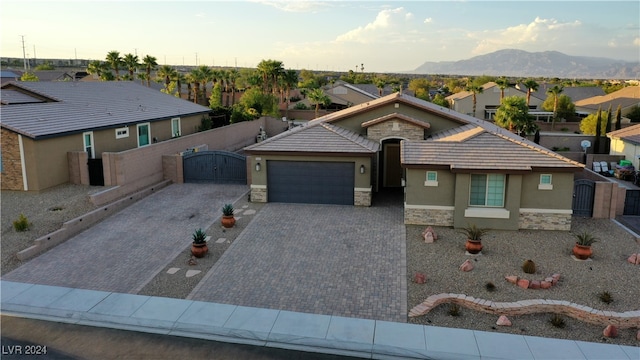 view of front of house featuring a mountain view and a garage