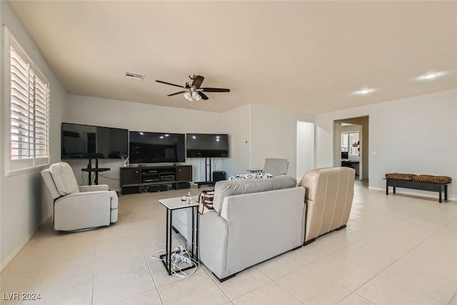 living room with light tile patterned floors and ceiling fan