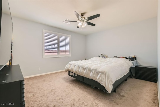 bedroom featuring ceiling fan and carpet