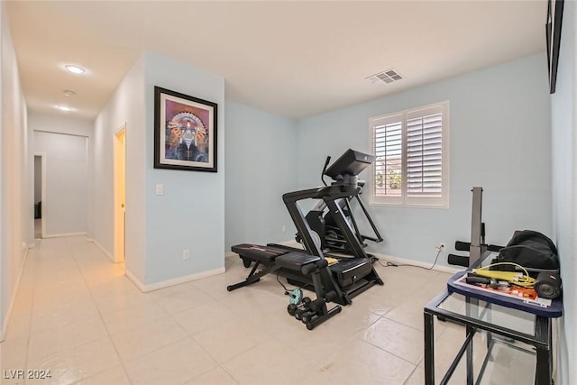 workout area with light tile patterned floors