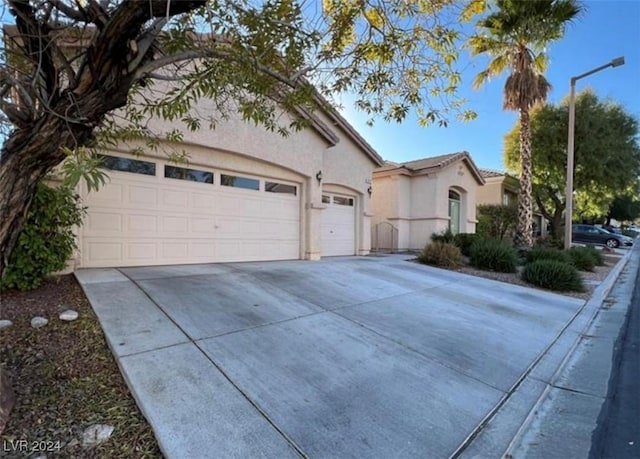 view of front of property with a garage