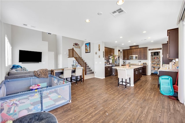 living room with dark hardwood / wood-style floors